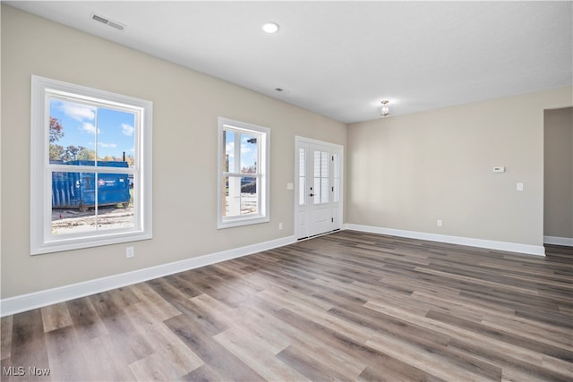 spare room featuring hardwood / wood-style flooring