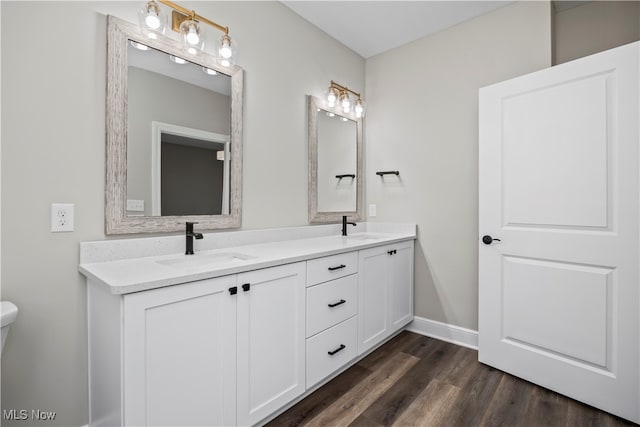 bathroom with vanity and hardwood / wood-style floors