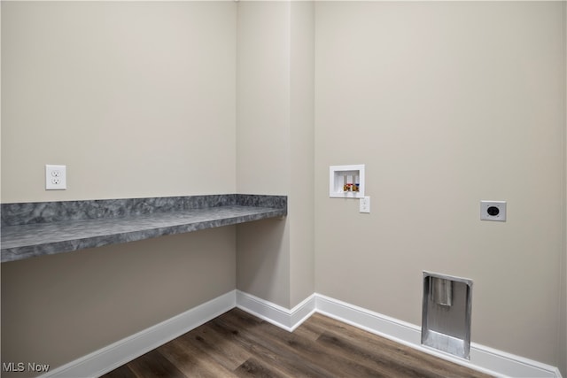 clothes washing area with electric dryer hookup, dark hardwood / wood-style flooring, and washer hookup