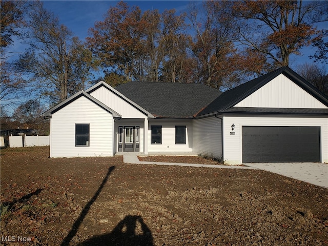 ranch-style house featuring a garage