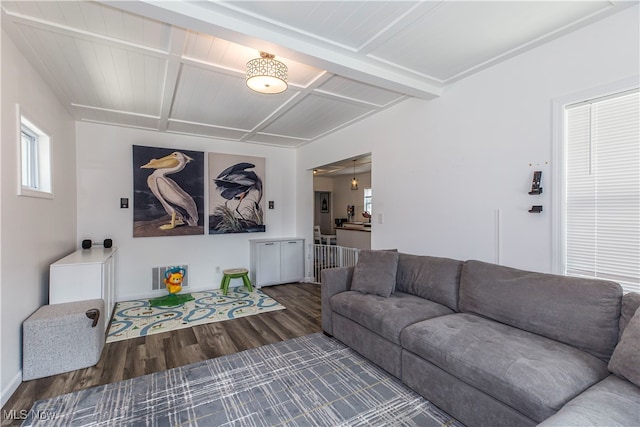 living room with beam ceiling, dark wood-type flooring, and coffered ceiling