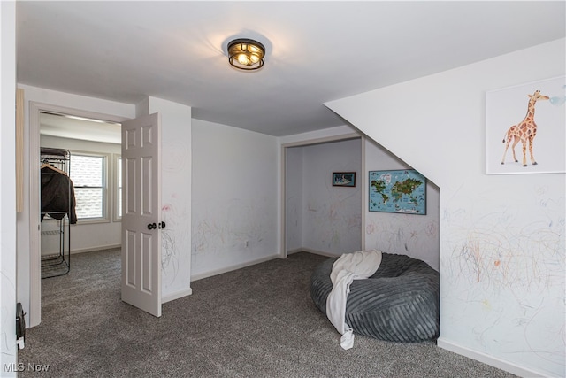 bedroom featuring dark carpet