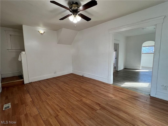 spare room with hardwood / wood-style flooring and ceiling fan