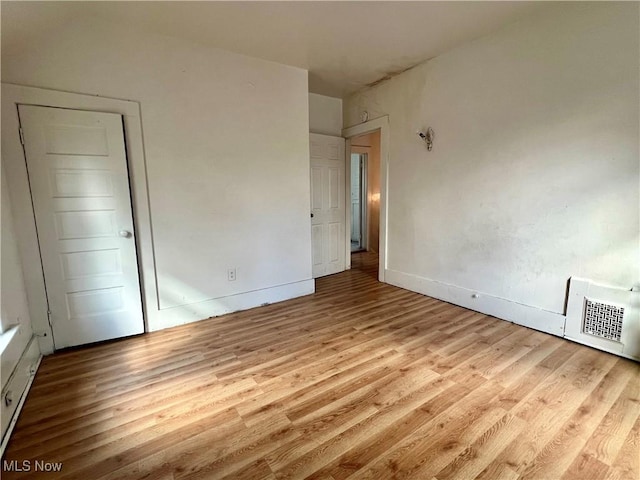 unfurnished bedroom featuring light hardwood / wood-style floors