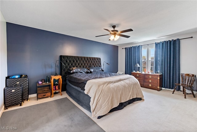 bedroom with ceiling fan and light colored carpet