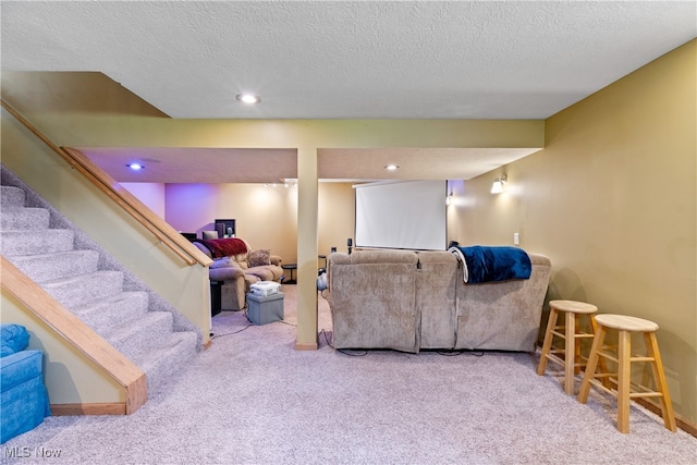 carpeted living room with a textured ceiling