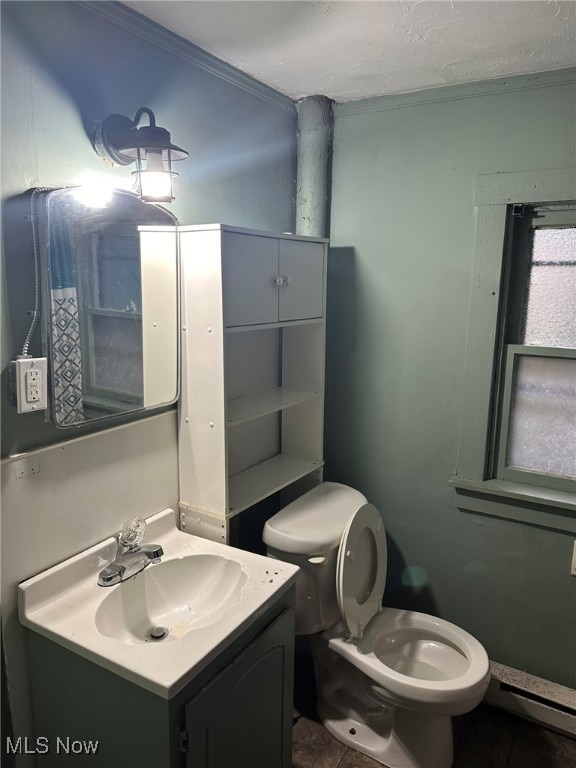 bathroom with tile patterned floors, vanity, a baseboard radiator, and toilet