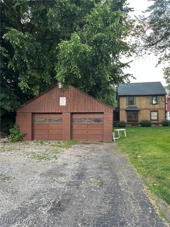 garage featuring a yard