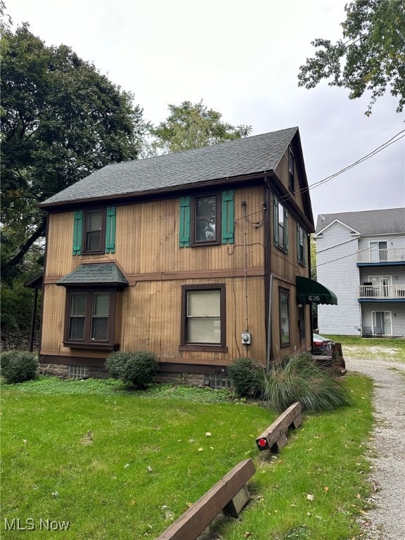 exterior space with a front lawn