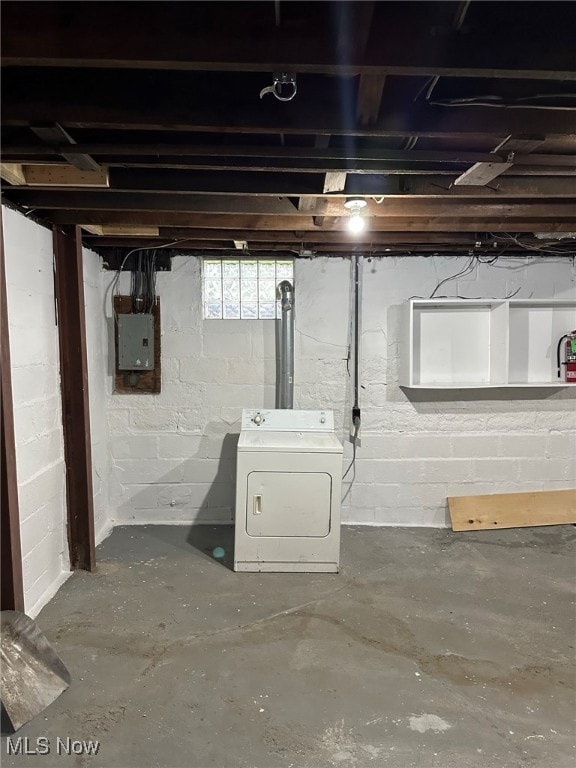 basement with washer / clothes dryer and electric panel