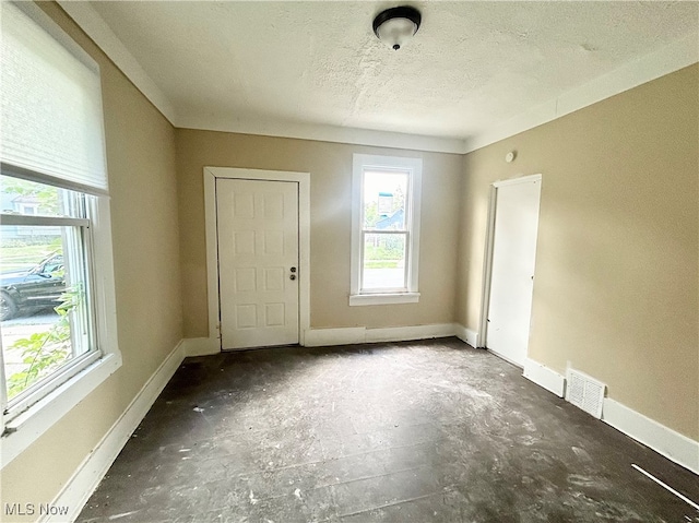 spare room featuring a textured ceiling