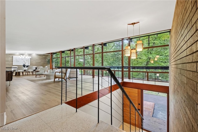 interior space with wood-type flooring and a notable chandelier