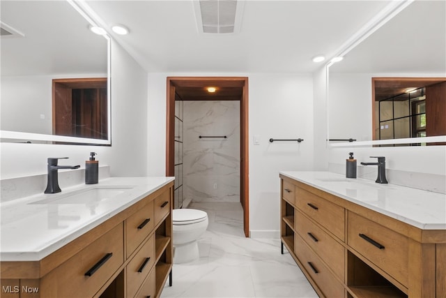 bathroom with tiled shower, toilet, tile patterned flooring, and vanity