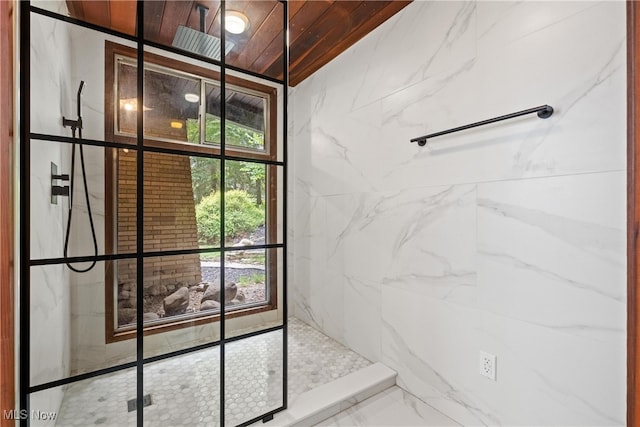 bathroom featuring wood ceiling and a tile shower