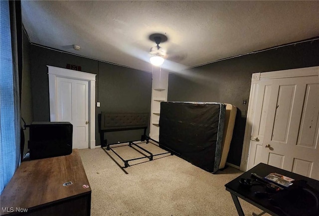 carpeted bedroom with a textured ceiling