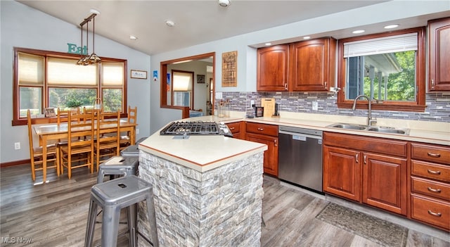 kitchen featuring light hardwood / wood-style flooring, stainless steel dishwasher, tasteful backsplash, sink, and lofted ceiling