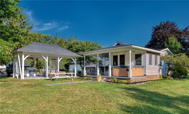 exterior space with a patio, a yard, and a gazebo