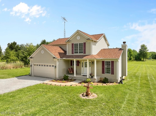 view of front property with a porch, a front yard, and a garage