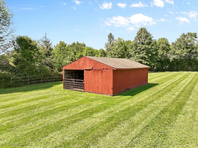 view of outbuilding with a lawn