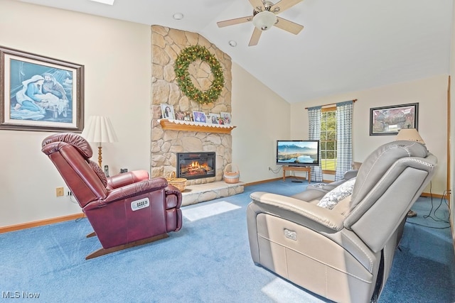 carpeted living room with lofted ceiling, a stone fireplace, and ceiling fan