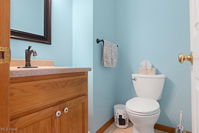 bathroom with vanity, toilet, and tile patterned floors