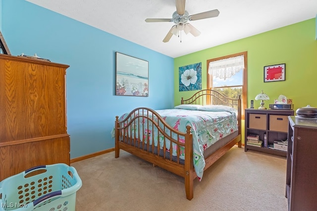 bedroom with light colored carpet and ceiling fan