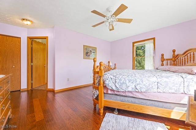 bedroom featuring ceiling fan and dark hardwood / wood-style flooring