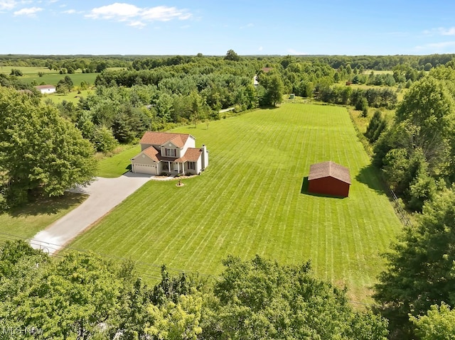 birds eye view of property with a rural view