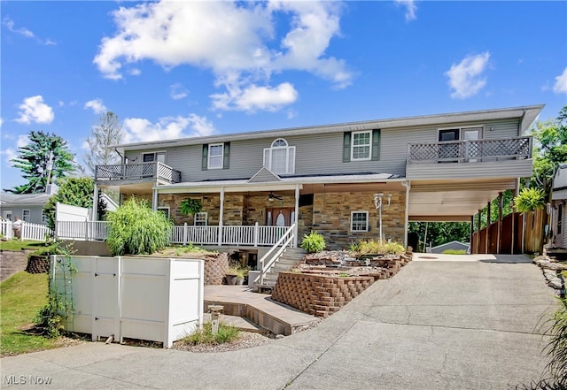 view of front of house with a balcony and covered porch