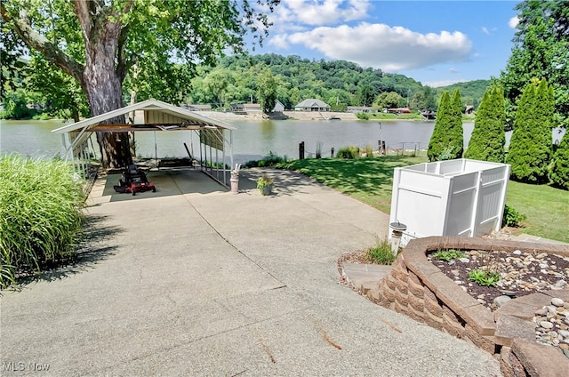 view of patio / terrace featuring a gazebo and a water view