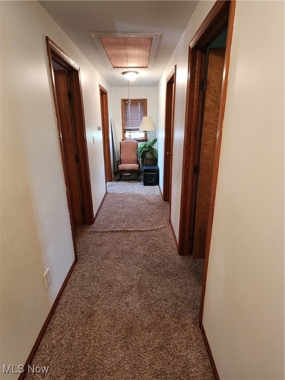 corridor with light colored carpet