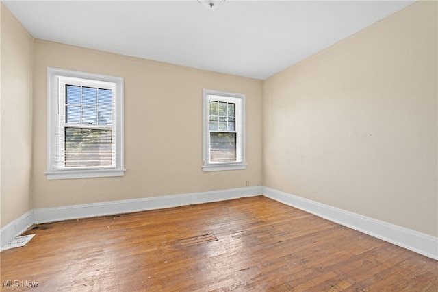 empty room featuring hardwood / wood-style flooring