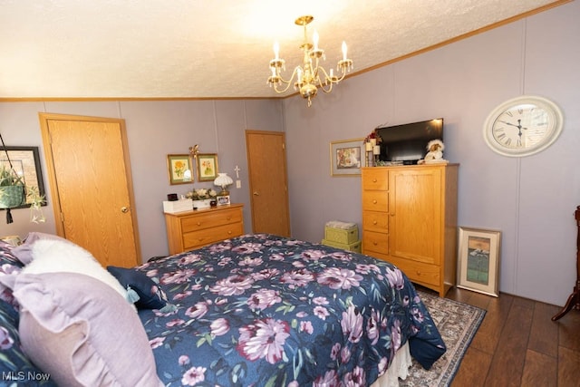 bedroom featuring a textured ceiling, dark wood-type flooring, vaulted ceiling, and ornamental molding