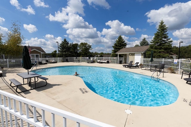 view of swimming pool featuring a patio area