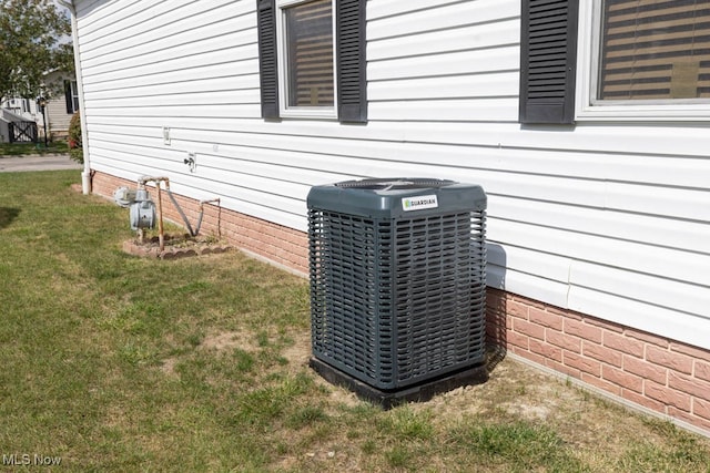 exterior details with carpet flooring and central air condition unit