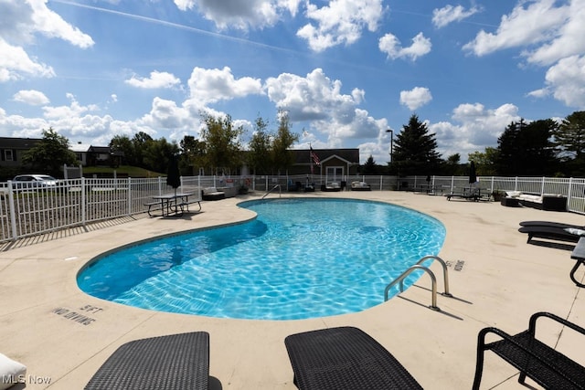 view of swimming pool with a patio area