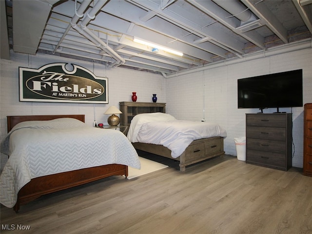 bedroom featuring wood-type flooring