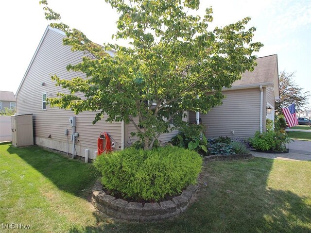 view of home's exterior with a lawn