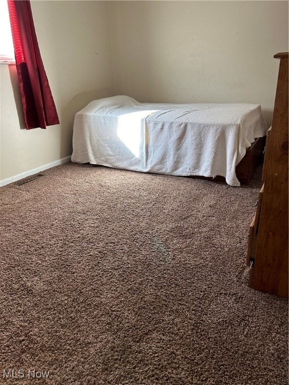 bedroom featuring carpet flooring