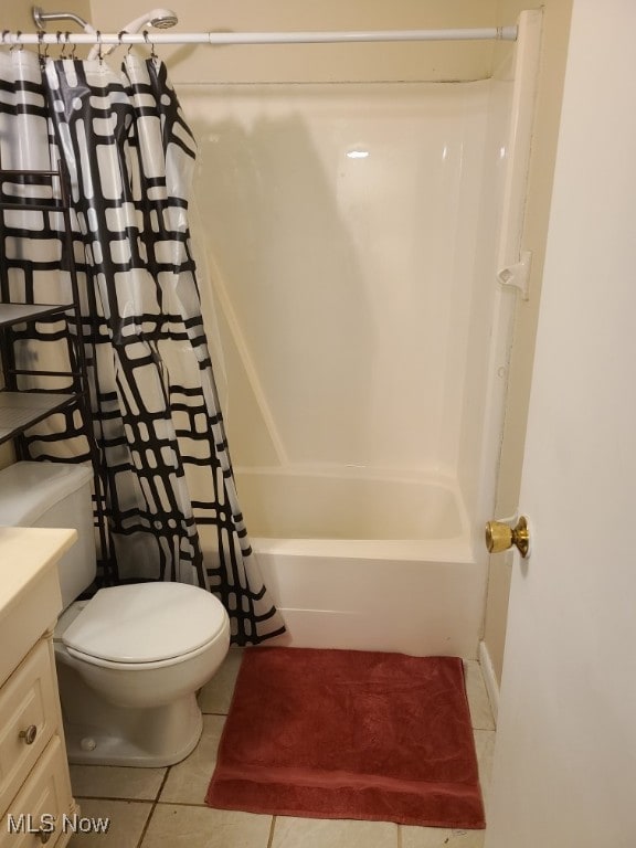 full bathroom featuring toilet, vanity, shower / bath combo, and tile patterned floors