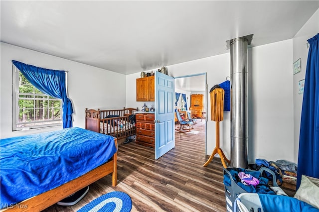 bedroom featuring dark hardwood / wood-style flooring