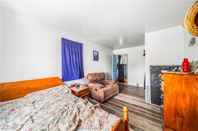 bedroom with hardwood / wood-style flooring