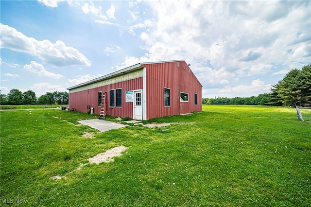 view of outdoor structure with a lawn