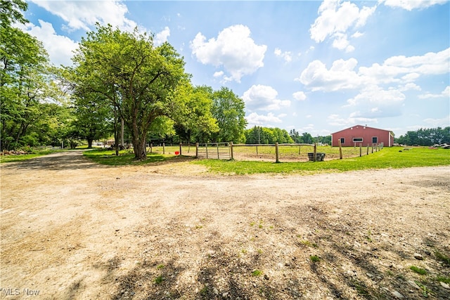 view of yard with a rural view