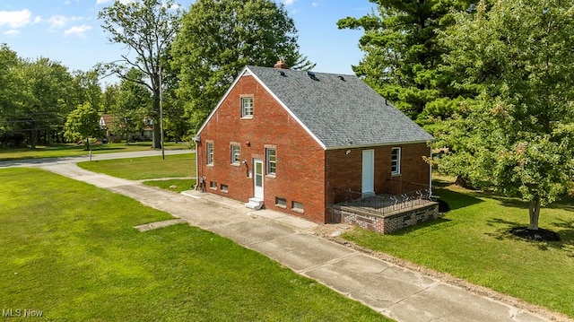 view of home's exterior with a yard