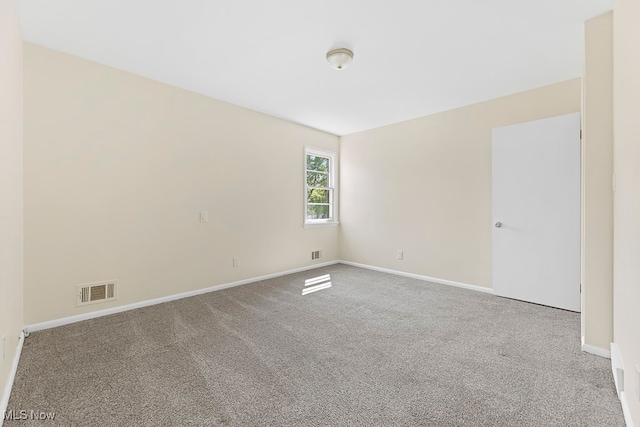 empty room with light colored carpet