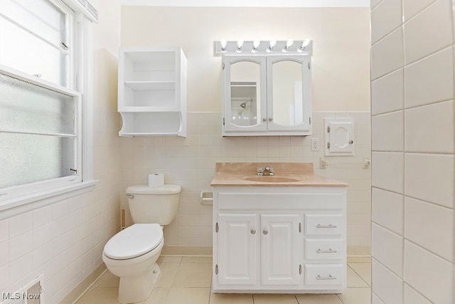 bathroom featuring tile walls, tile patterned flooring, vanity, and toilet