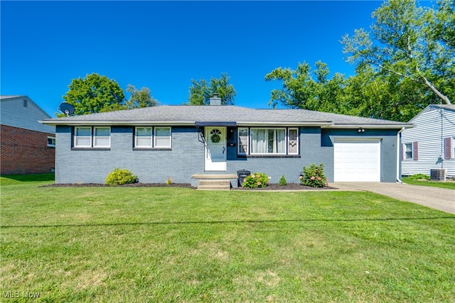 single story home featuring a garage, a front lawn, and central AC unit