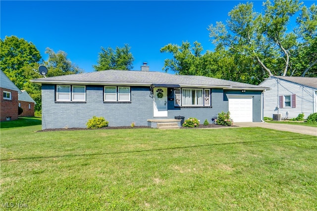 single story home with central air condition unit, a front yard, and a garage