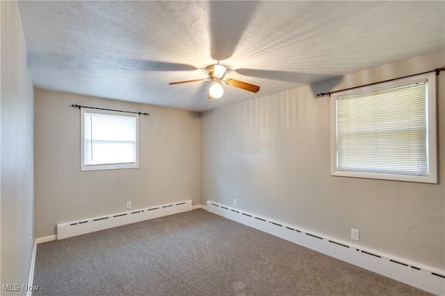 spare room featuring a baseboard radiator, carpet floors, a textured ceiling, and ceiling fan